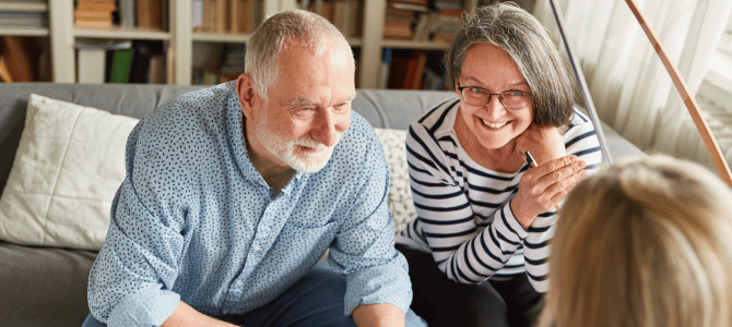 An older couple meeting with a financial advisor