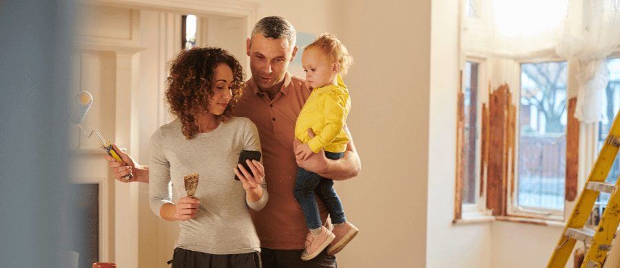 Young couple remodeling their home with their toddler