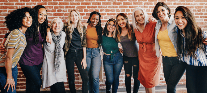 Group of women linking arms