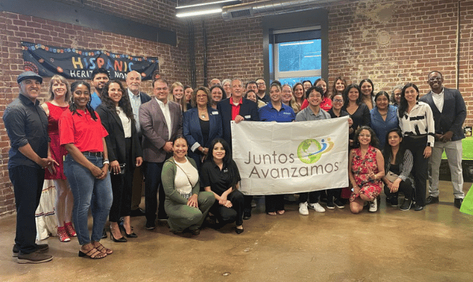 Freedom First celebrating the Juntos Avanzamos designation with community members